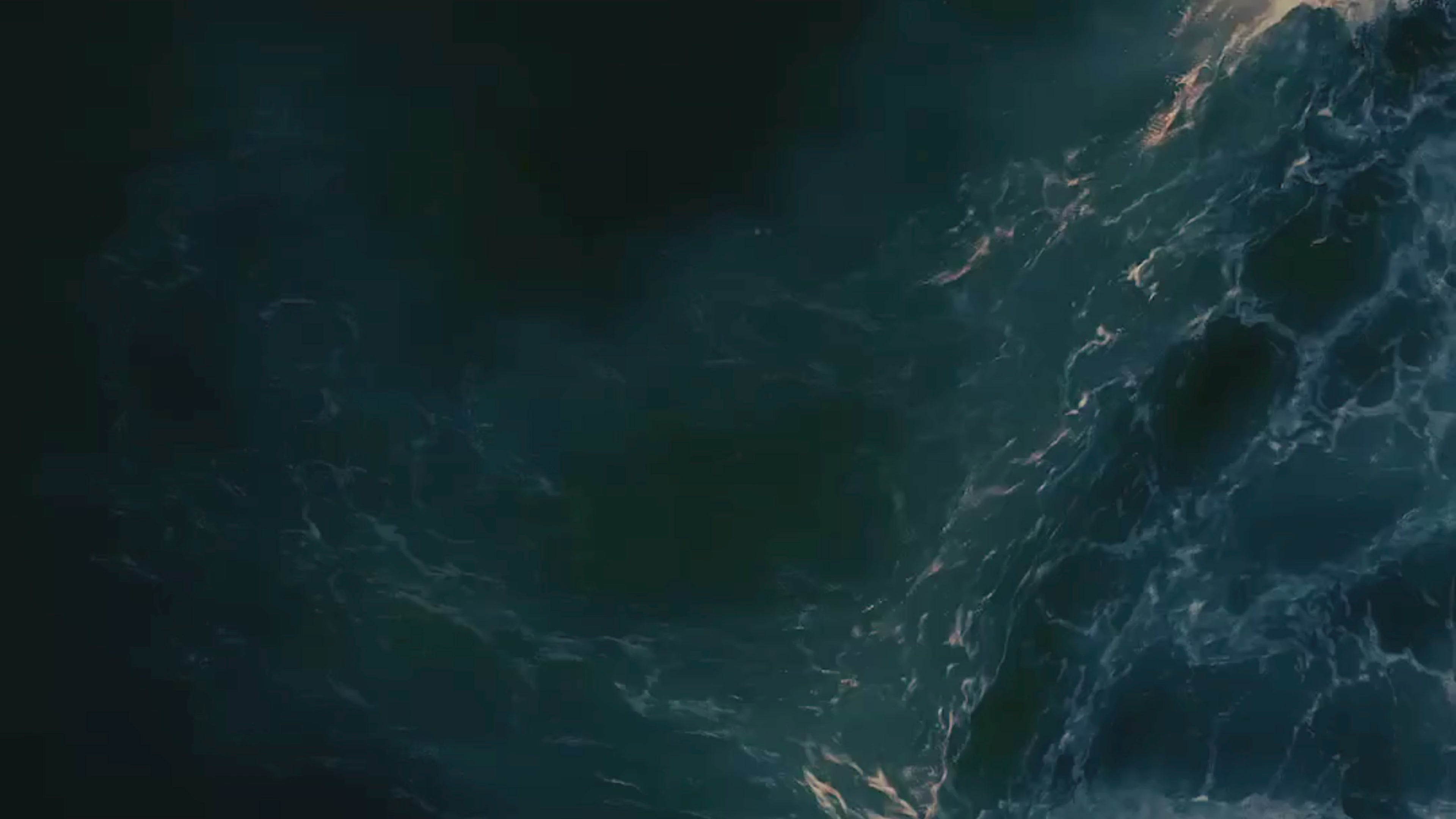 Load video: The House of Ossory logo, in midnight blue, slowly emerges from the ocean as white sea foam gradually reveals and highlights it.